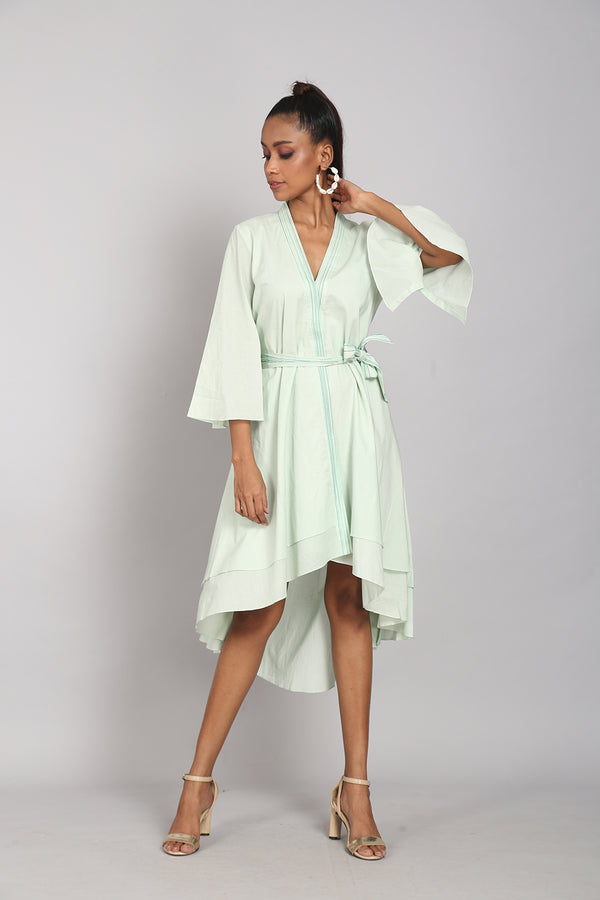 Green asymmetrical dress with belt